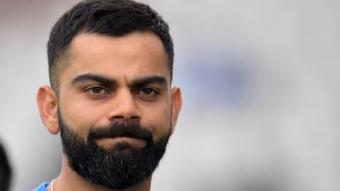 India"s captain Virat Kohli reacts at the end of play during the 2019 Cricket World Cup first semi-final between New Zealand and India at Old Trafford in Manchester, northwest England, on July 10, 2019.