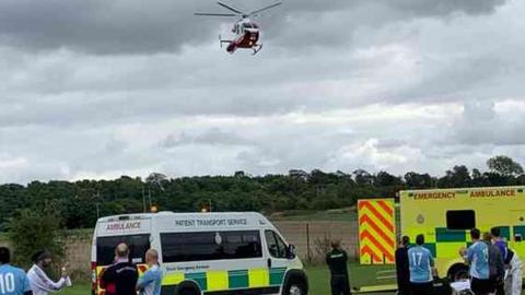 Air ambulance and paramedics at scene