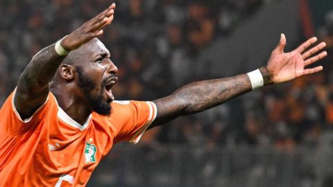 Seko Fofana celebrates Ivory Coast's last-minute equaliser against Mali in the 2023 Africa Cup of Nations quarter-finals