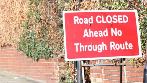 Residential street in Jesmond with road closure sign