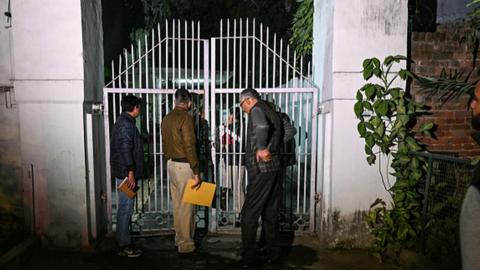 Police personnel conduct an inquiry after an alleged explosion occurred near the Israeli embassy in New Delhi on December 26, 2023