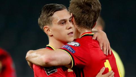 Leandro Trossard celebrates with Dennis Praet after Belgium score against Belarus in a World Cup 2022 qualifying game