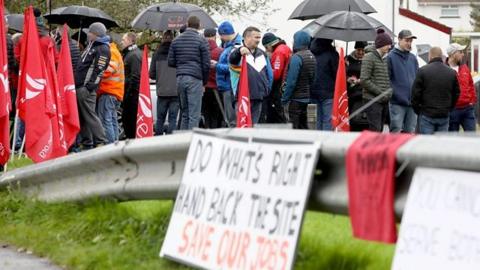 Former Wrightbus workers outside the factory