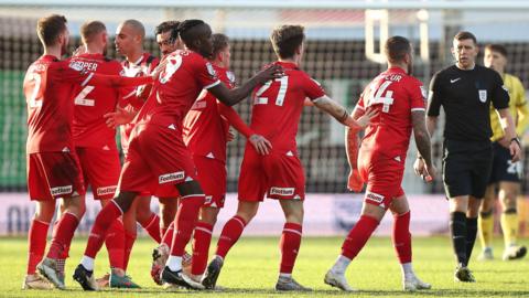 Leyton Orient players celebrate George Moncur's winner at Oxford