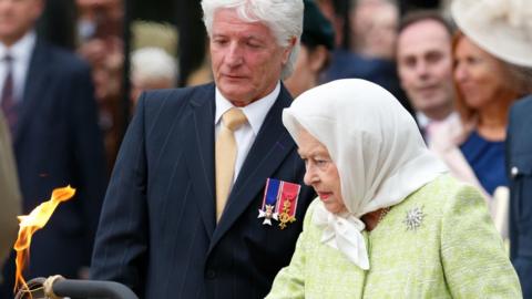 Bruno Peek lighting the beacon at Windsor for the Queen's 90th birthday celebrations in 2016