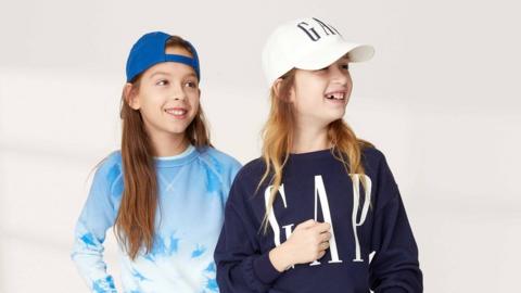 Child models wearing GAP jumpers