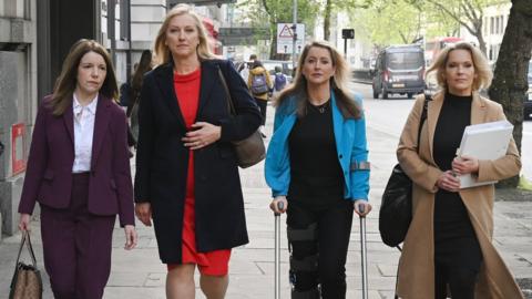 (L-R) Annita McVeigh, Martine Croxall, Karin Giannone and Kasia Madera, walk along Kingsway as they arrive for employment tribunal.