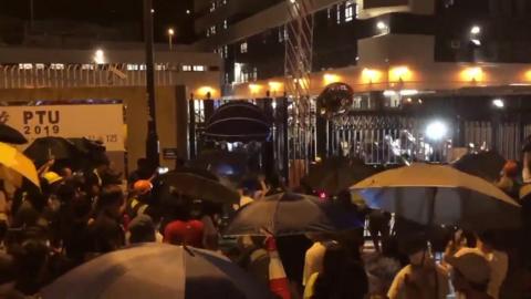 Crowd gathers outside Kwai Chung Road police station