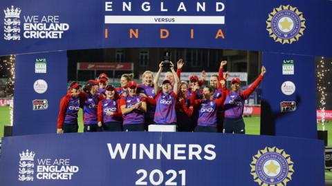 England celebrate with the multi-format series trophy