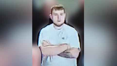 CCTV image of a man police want to speak to in connection with a flare being thrown during a Sunderland match