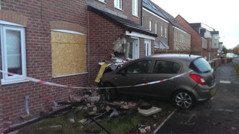 Car crashed into front of house