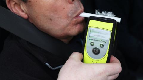 Driver using breathalyser