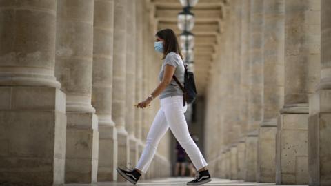 woman walks in paris