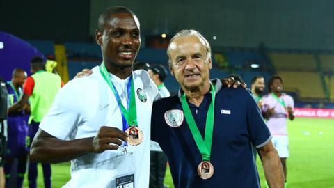 Nigeria striker Odion Ighalo (left) with coach Gernot Rohr after winning bronze at the 2019 Africa Cup of Nations