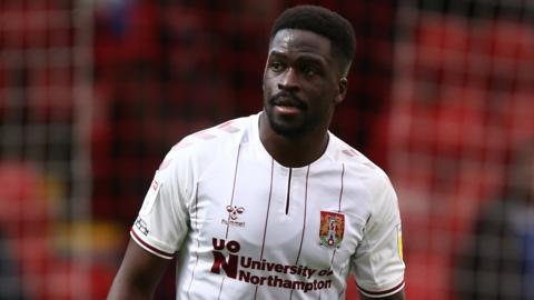 Christopher Missilou in action for Northampton Town