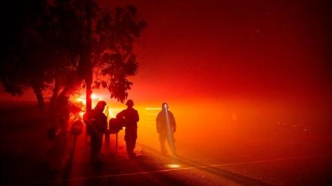 Firefighters in the fog of smoke