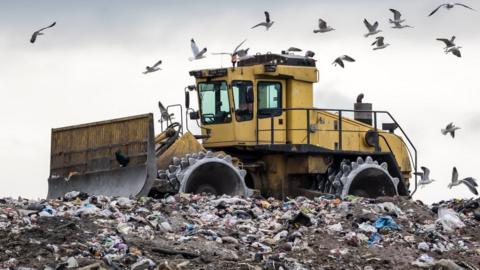 A digger at landfill