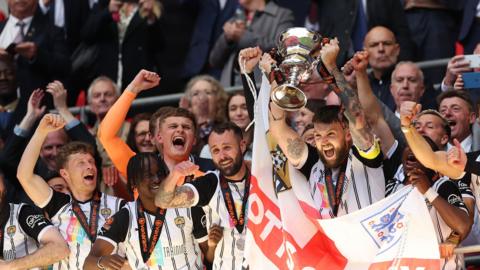 Notts County celebrate winning promotion to the EFL