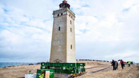 Men work on the lighthouse in Rubjerg Knude that is being moved away from the coastline on October 22, 2019 between Lonstrup and Lokken, Jutland, Denmark