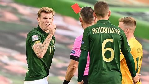 Republic of Ireland's James McClean is sent off for a second booking