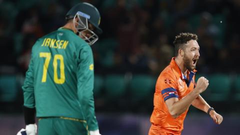 Paul van Meekeren of the Netherlands (right) celebrates the wicket of South Africa's Marco Jansen (left)