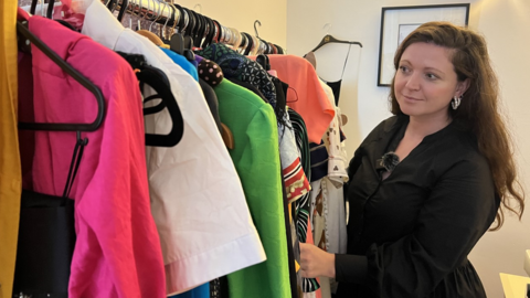 Laura Horton looks at a rail of brightly coloured clothes