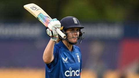Nat Sciver-Brunt raising her bat for a century against Sri Lanka