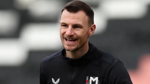 Tommy Smith warming up with MK Dons