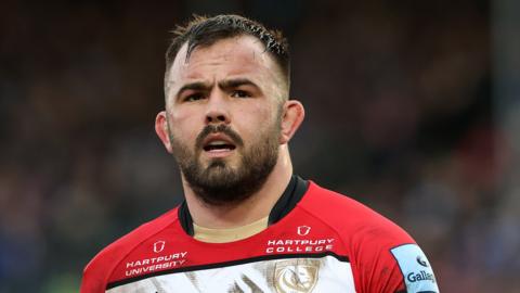 George McGuigan stands on the pitch during the Premiership Rugby Cup final