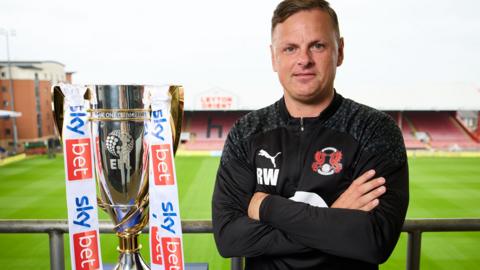 Leyton Orient manager Richie Wellens with the League One trophy at Brisbane Road