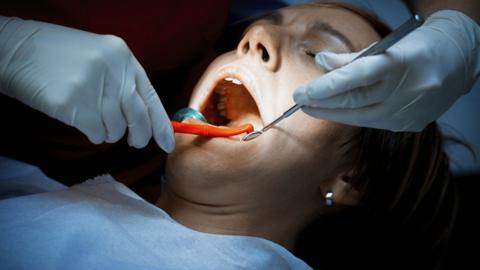 Woman in dentist's chair