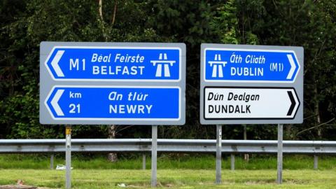 Belfast, Newry, Dublin and Dundalk directional road signs.