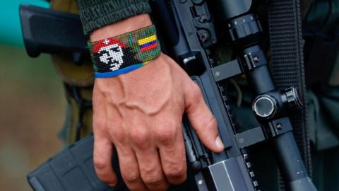 View of the handband of a FARC dissident guerrilla holding a rifle, in Casa Roja, Colombia, 16 April 2023 (issued 17 April 2023)