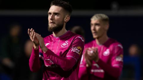 Swansea's Matt Grimes applauds the fans