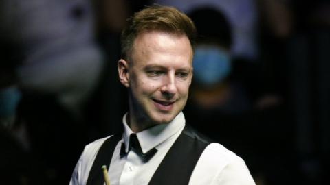 Judd Trump looks to the side