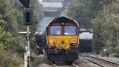 The train with its tankers across the tracks