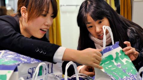 Two women with bags