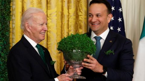 Joe Biden receiving a bowl of shamrocks from Leo Varadkar