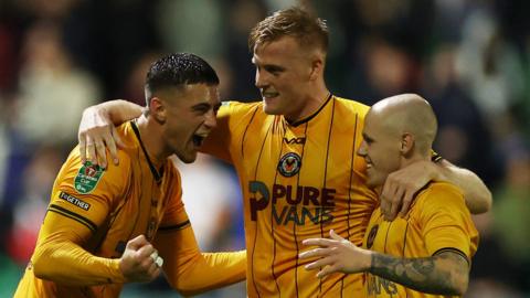 Will Evans of Newport County celebrates scoring a goal