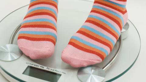 Person in stripy socks on scales