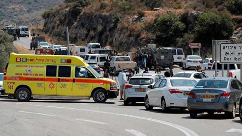 Israeli medics and security forces at scene of bomb attack near settlement of Dolev