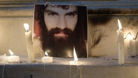 A portrait of Santiago Maldonado -disappeared on August 1st during a Mapuche protest in Chubut province- is surrounded by candles outside the judicial morgue was carried out in Buenos Aires.