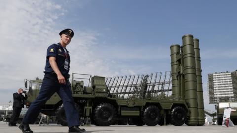 File photo: A Russian military official walks in front of The S-400 Triumph anti-aircraft missile system, 22 August 2017