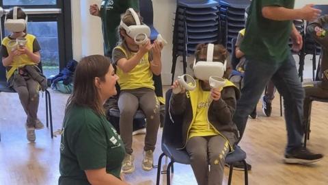 Girls wearing virtual reality headsets at STEMFest