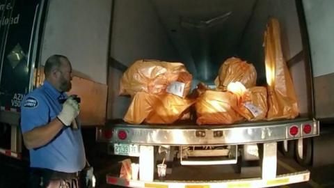 Tractor trailer with bags filled with jewellery