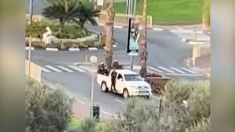 A white truck thought to be carry militants drives through Sderot