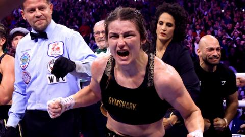 Katie Taylor celebrates after beating Chantelle Cameron