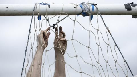 A net being attached to a crossbar