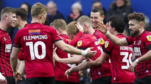 Millwall celebrate Duncan Watmore's goal at Loftus Road