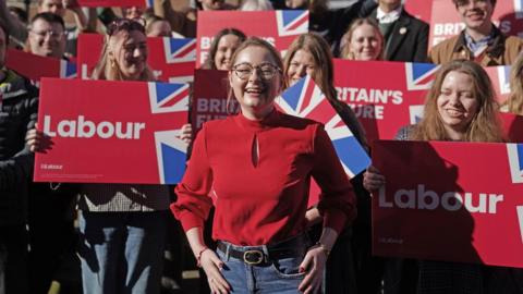 Newly elected Labour MP Gen Kitchen (centre) surrounded by Labour party supporters after being declared winner in the Wellingborough by-election